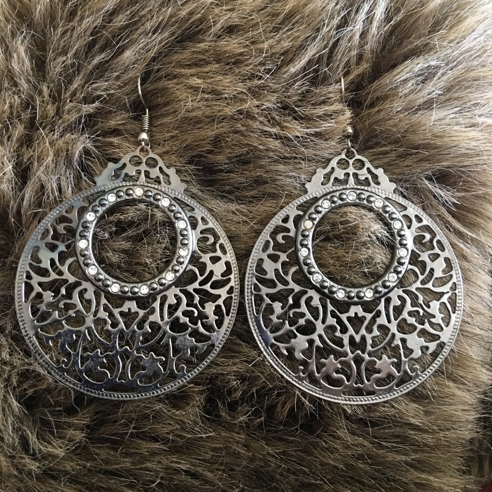 Large chrome tone scroll rhinestone earrings